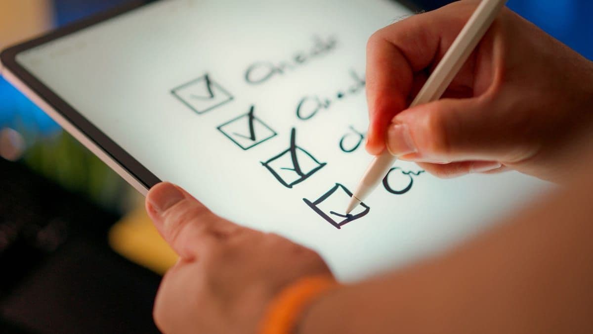 A digital checklist on a tablet with a stylus